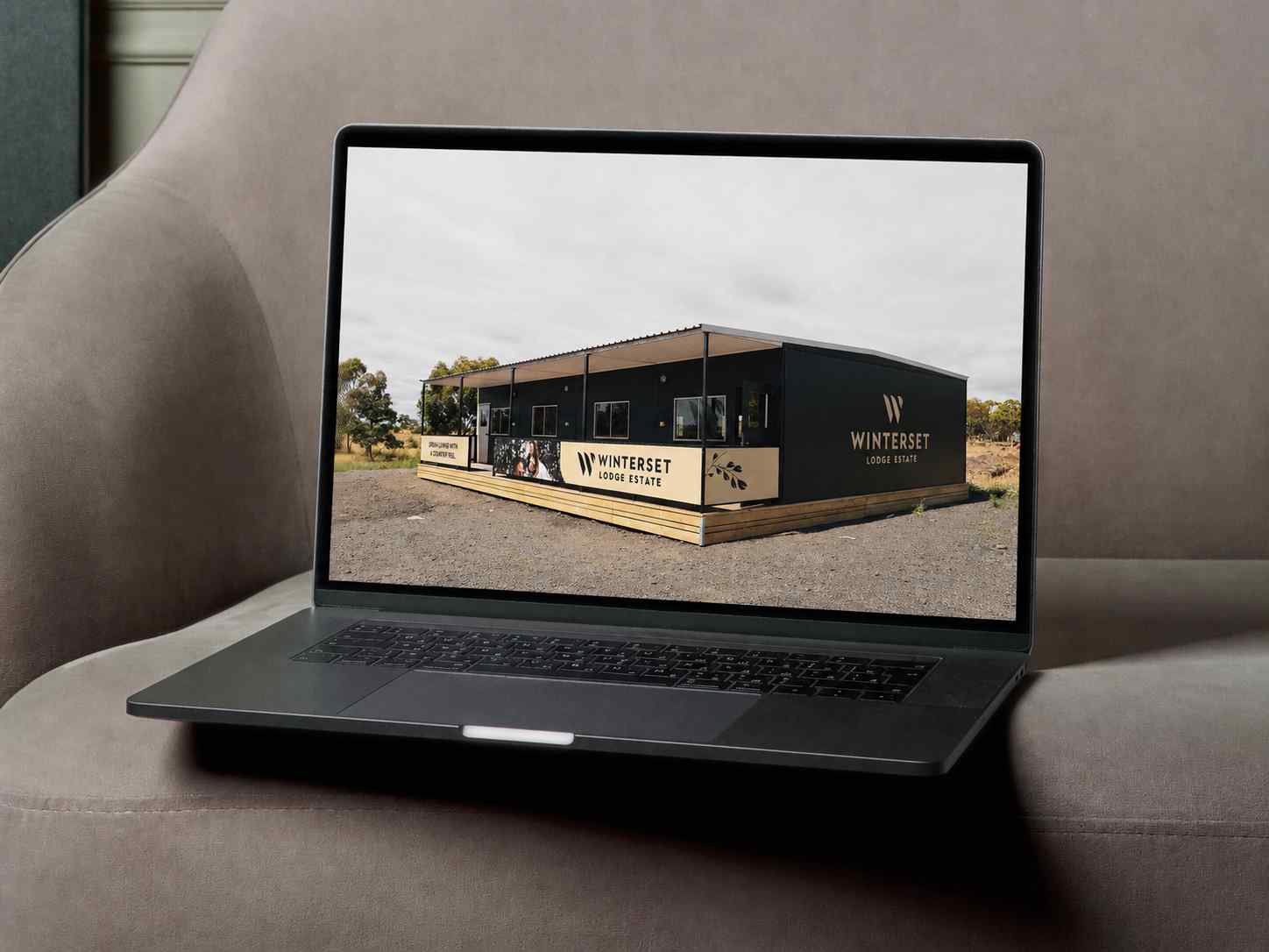 Display home brand site redesign on laptop.